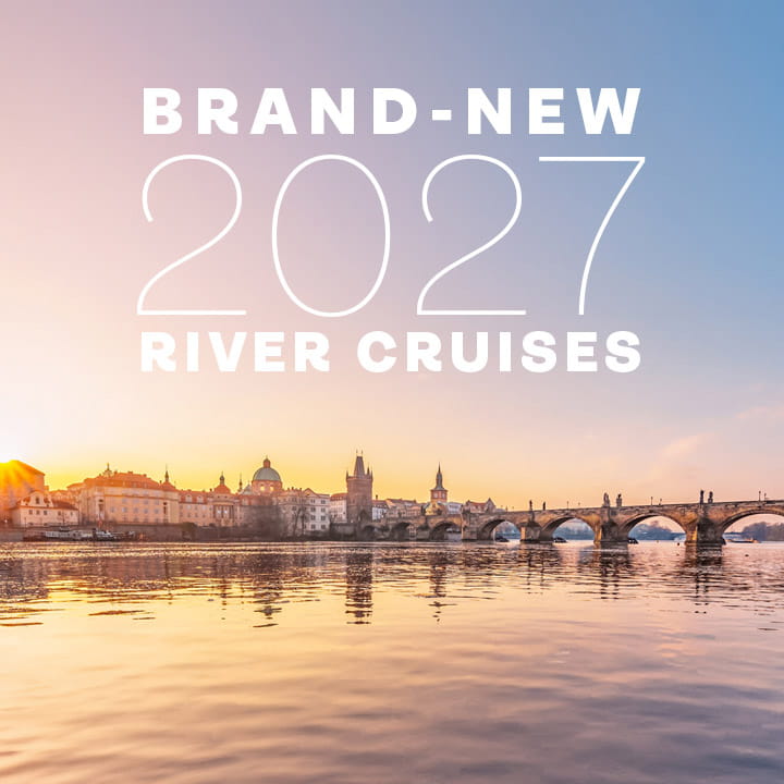 A view of Charles Bridge in Prague with the words 'Brand-new 2027 river cruises' superimposed in white